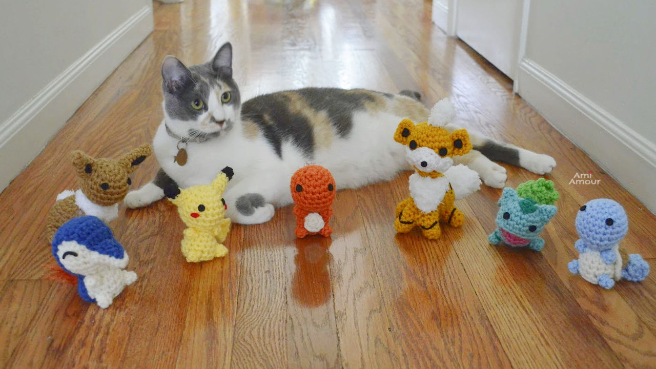 Calico Cat surrounded by Crochet Pokemon
